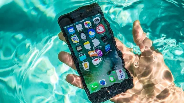 iPhone water damage repair at iTweak — board-level technician work